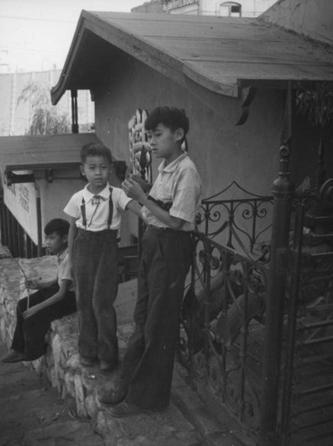 Boys in front of the Golden Phoenix, China City