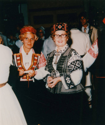 Velga and Velta in traditional Latvian dress