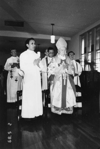 Cardinal and clergy at St. Bridget's Catholic Chinese Center