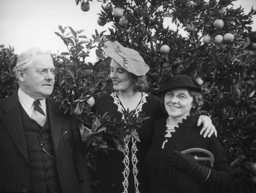 Ethel Schultheis and parents at an orange grove near Piru