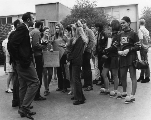 Students talk to striking teachers