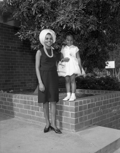 Woman with child wearing sash