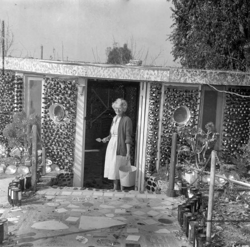 Grandmother displays bottle 'Round House