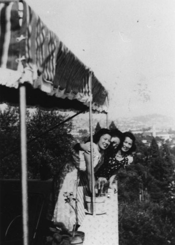 Asian American women on balcony