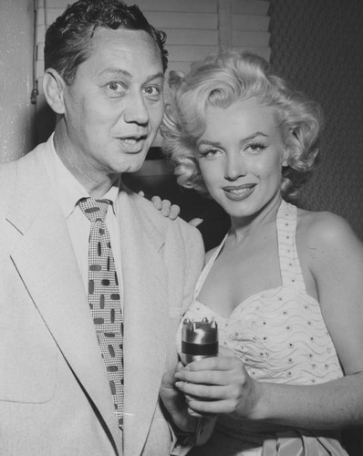 Marilyn Monroe and disc jockey Peter Potter at Grauman's hand and footprint ceremony