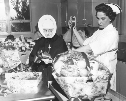 Nun and nurse ready Christmas baskets at St. Joseph Hospital