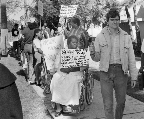 Demonstrators protest in front of First AME Church