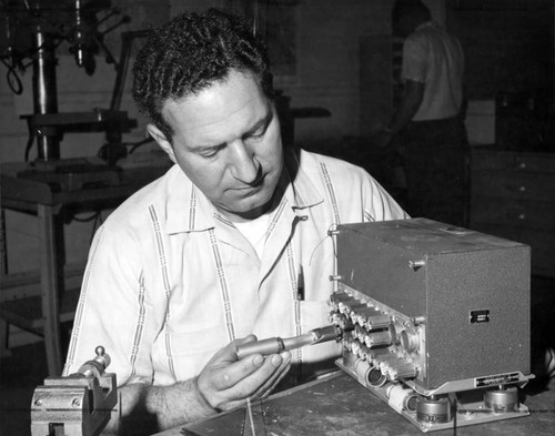 Edwards machinist shows invention