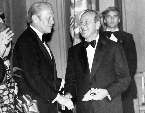 Leonard Firestone congratulated by Gerald Ford