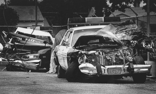 Damaged police cars