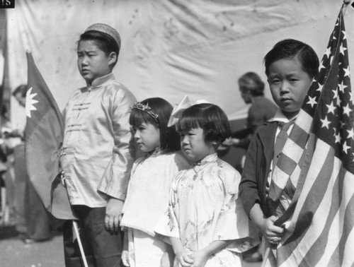 Two boys and two girls in costumes