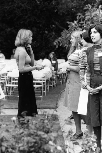 Rose Queen Anne Martin talking with contestants