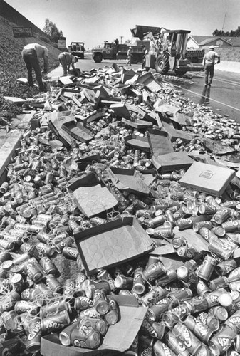 Cans spilled off a semi-truck trailer