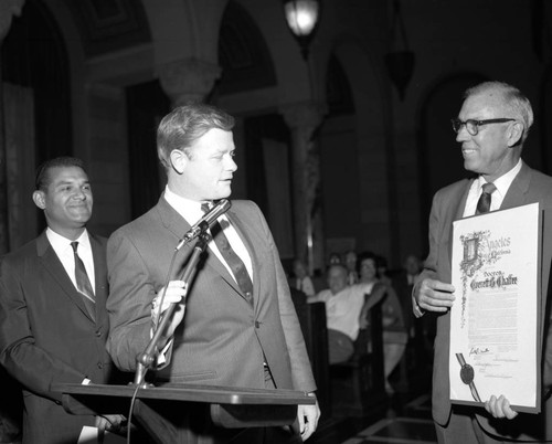 Billy Mills and Art Snyder present resolution to Dr. Everett B. Chaffee