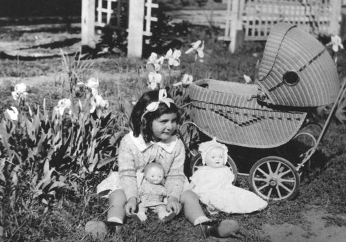 Girl with dolls