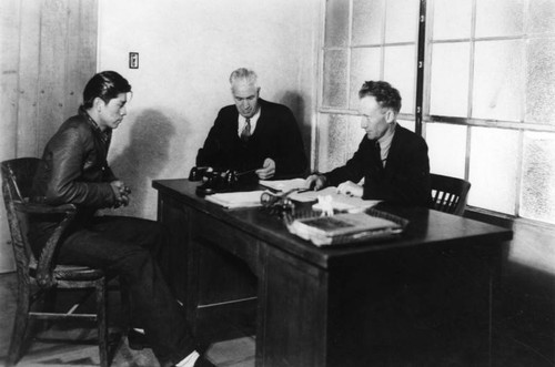 American Indian student in office with administrators