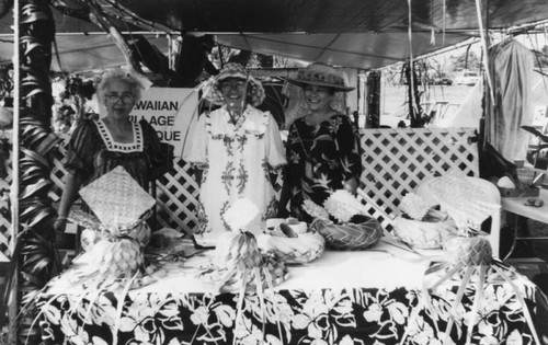 Women behind Hawaiian Village Boutique table