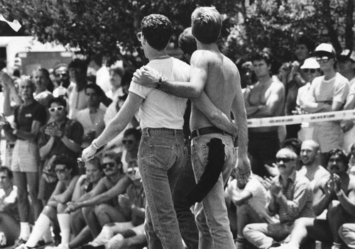 Pair walks in Gay Pride Parade