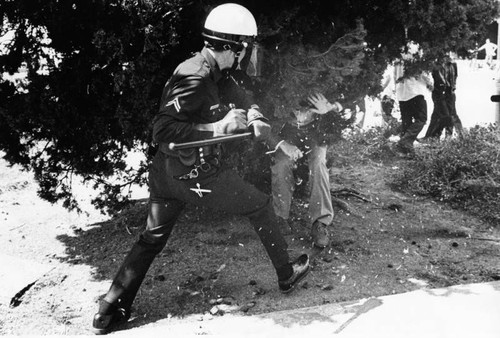 LAPD officer goes after rock throwing protester