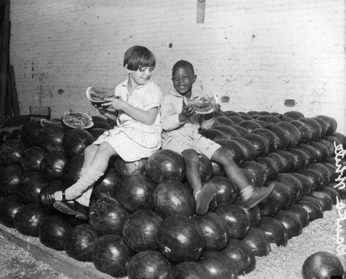 Children eating watermelons