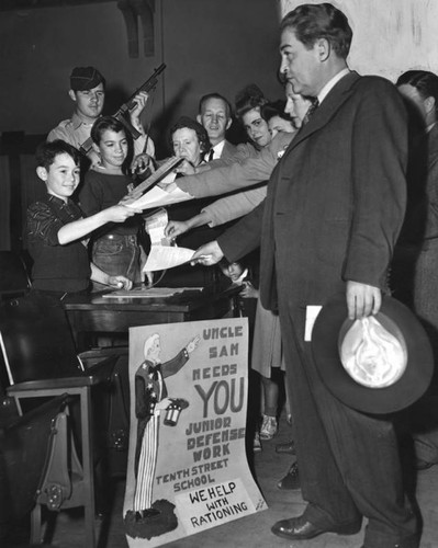 Junior army members distribute declaration forms