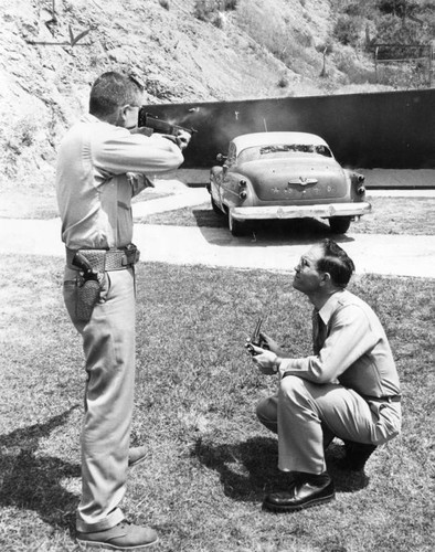 Two officers test .38 caliber guns