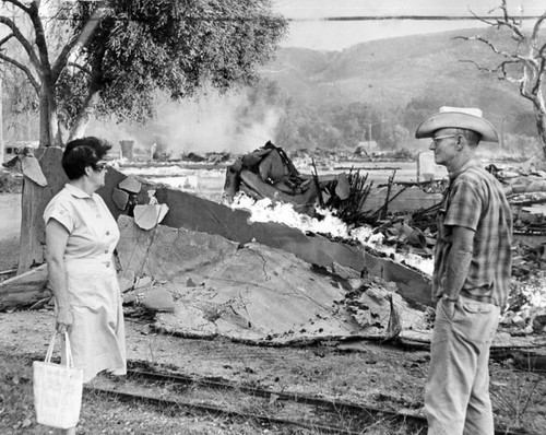 Mabel and Jim Sprague view Melody Ranch rubble