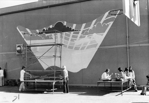 Students working on a mural