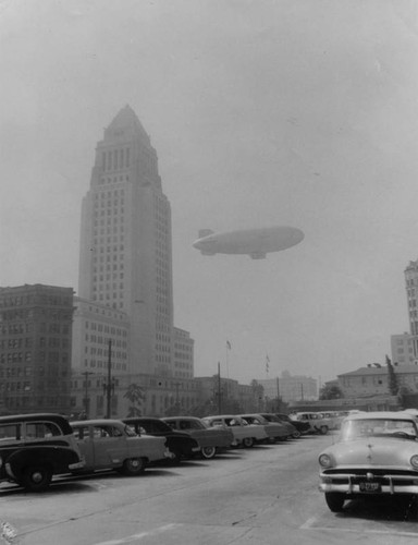 Blimp flies through smog