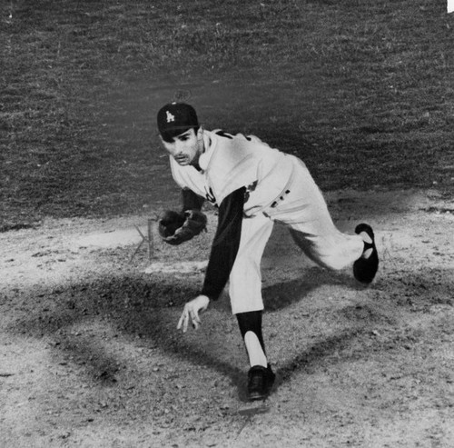 Dodger Sandy Koufax pitches the ball