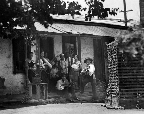 Musicians along back "corredor" of Avila Adobe