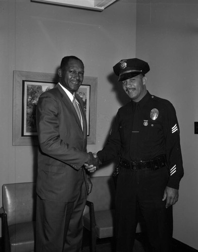 Tom Bradley greets LAPD officer