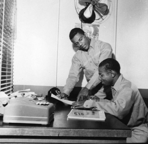 Two men at desk