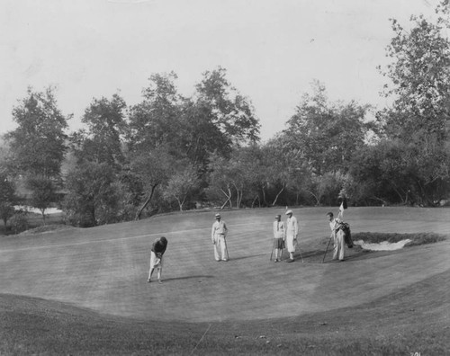 On the green at Riviera Country Club