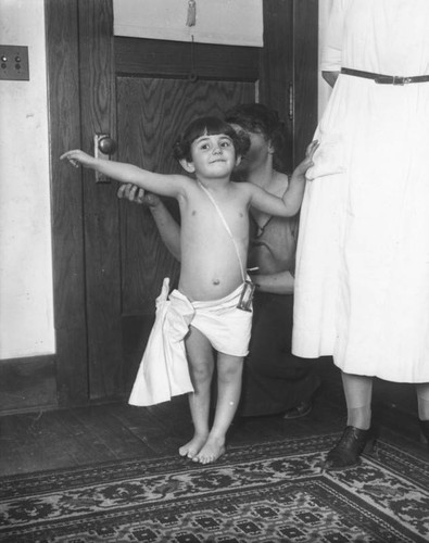 Young girl dressed as baby New Year