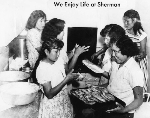 Girls making fry bread