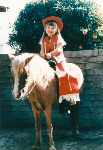 Girl playing cowboy