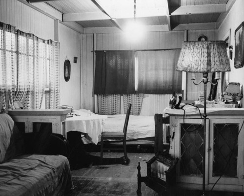 Interior view of three room home of Mary Tucker