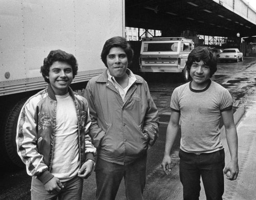 Three men at the Produce Market