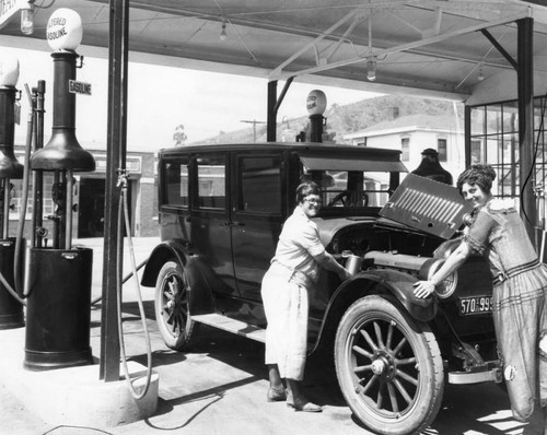 Two women at the service station