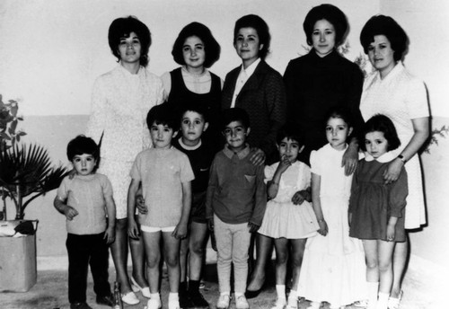 Preschoolers pose for their graduation photo