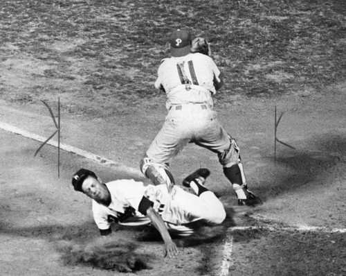 Phillies' Clay Dalrymple blocks Dodgers' Maury Wills at home in yesterday's action