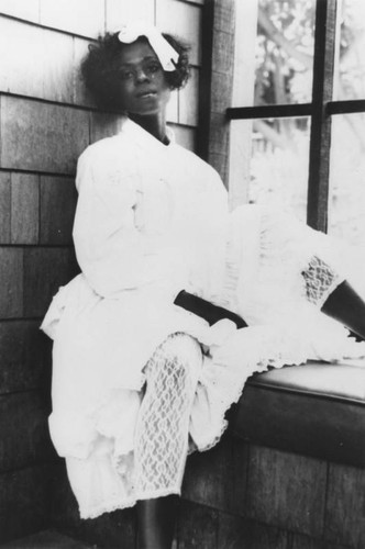 Woman sitting by a window