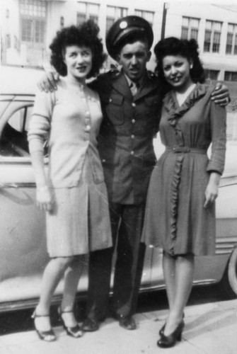 Soldier with two women