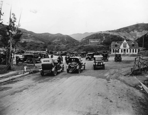 Muddy road and cars