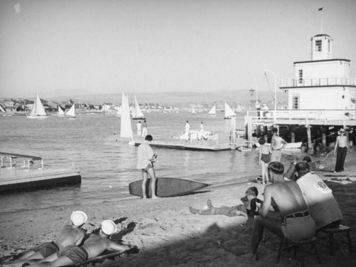 Boys and boats at Balboa Beach