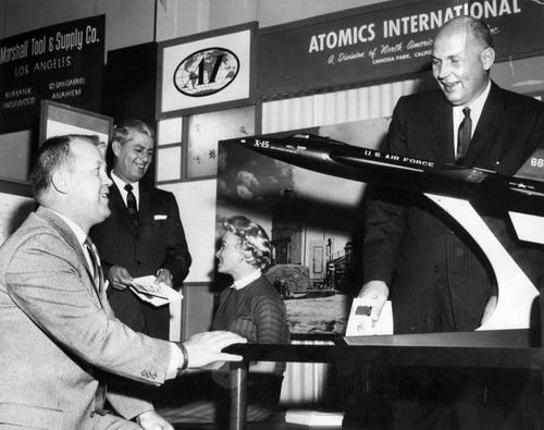 Industry leaders inspect model