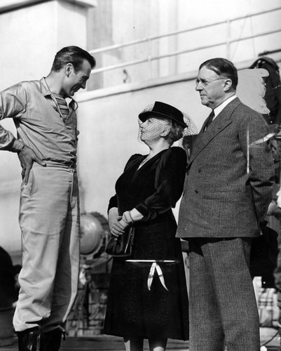 Gary Cooper greets alma mater president and wife