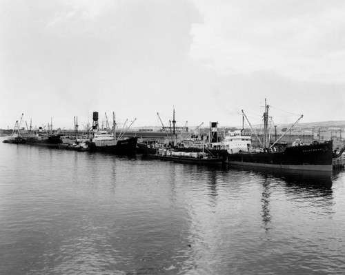 Three ships anchored in the harbor