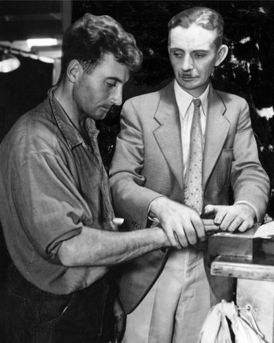 Albert Dyer being fingerprinted